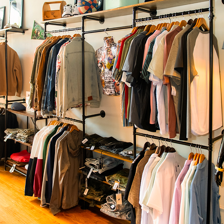 a rack full of clothing items